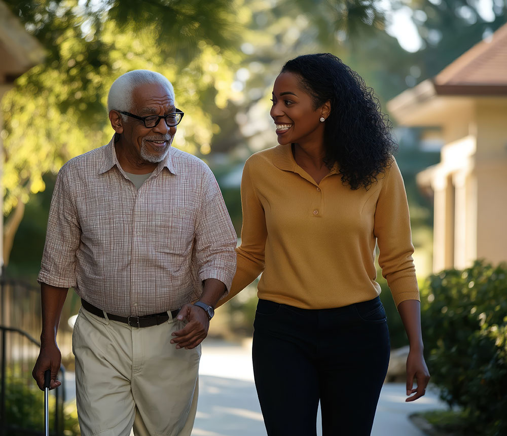Happy African American daughter walks with senior father